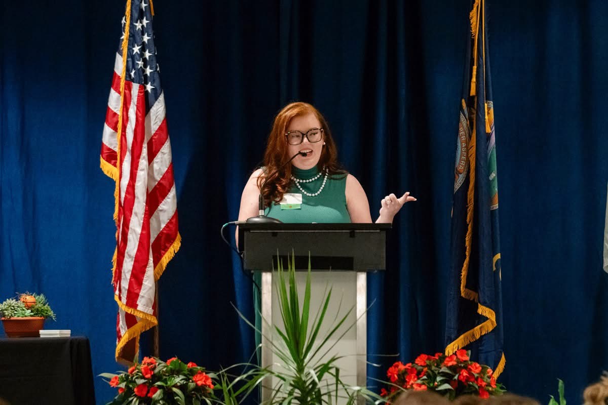 Sierra Marie Bonn speaking at a podium